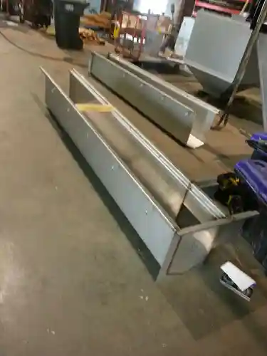 Stainless steel floor drain in a commercial dining facility kitchen